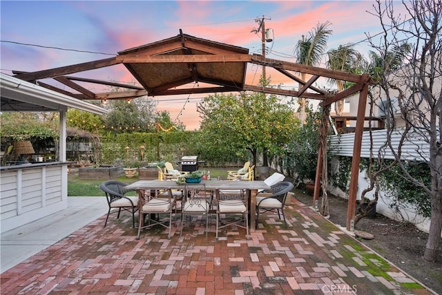 patio terrace at dusk with outdoor dining space