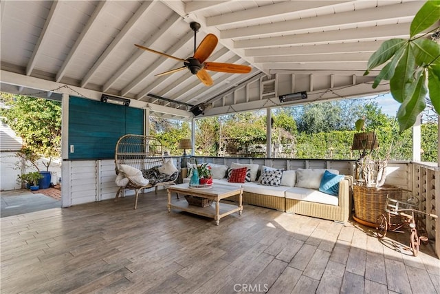 view of patio with a ceiling fan and an outdoor living space