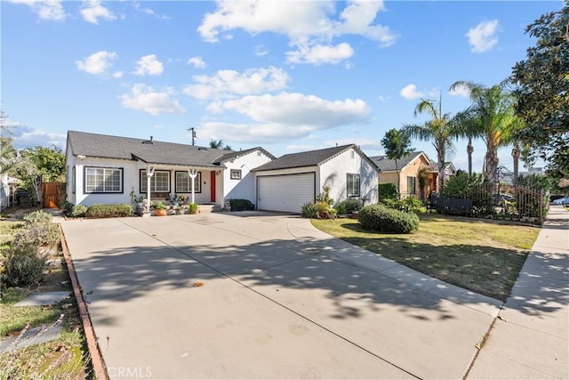 ranch-style home featuring stucco siding, concrete driveway, an attached garage, fence, and a front lawn