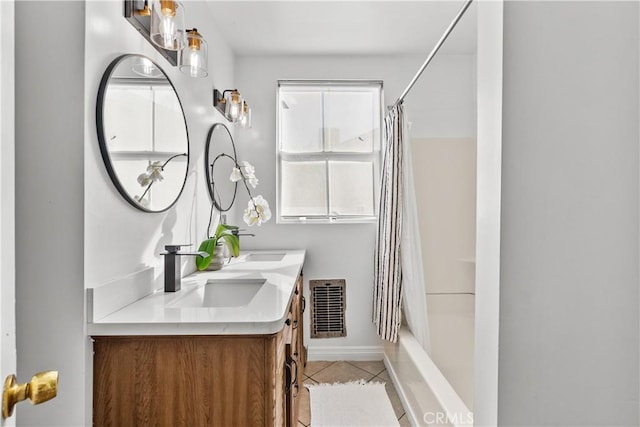 bathroom featuring double vanity, visible vents, tile patterned floors, shower / bathtub combination with curtain, and a sink