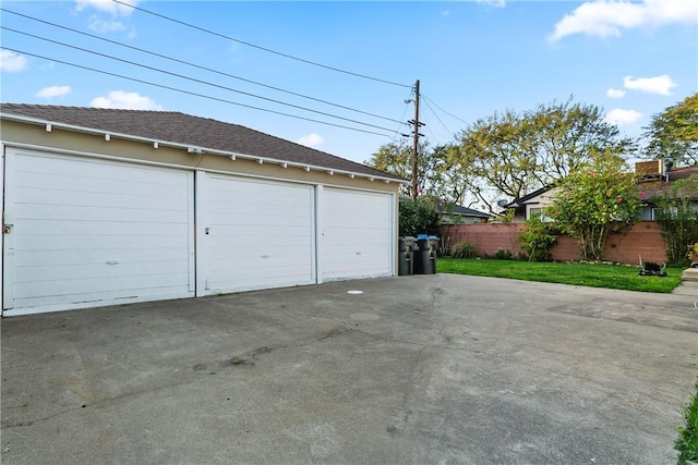 garage with fence