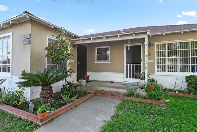 view of front of house featuring stucco siding