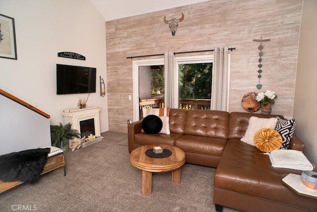 living room with carpet floors and a fireplace