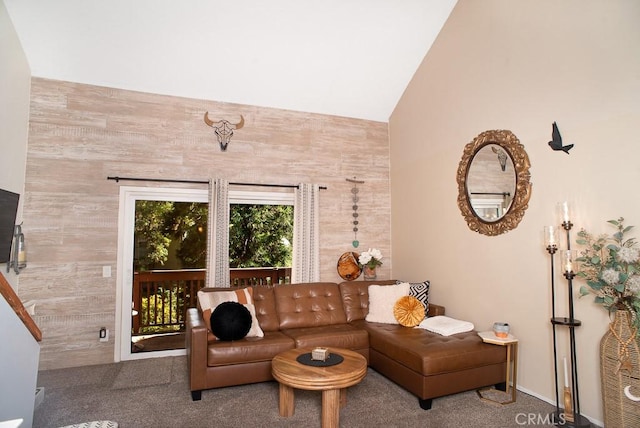 living room with vaulted ceiling and carpet flooring