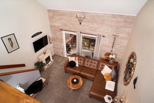 living room with carpet floors and a fireplace