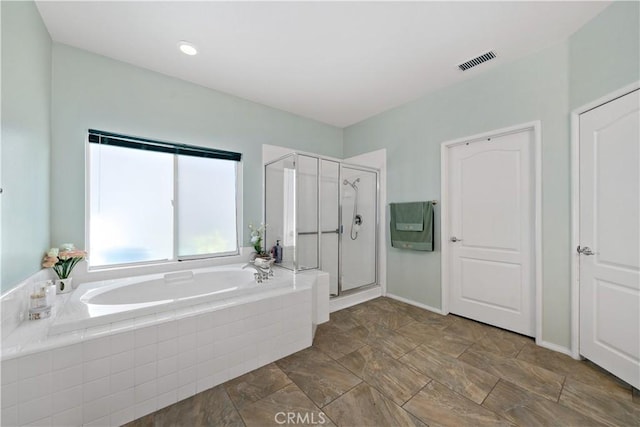 full bathroom with a stall shower, visible vents, and a garden tub