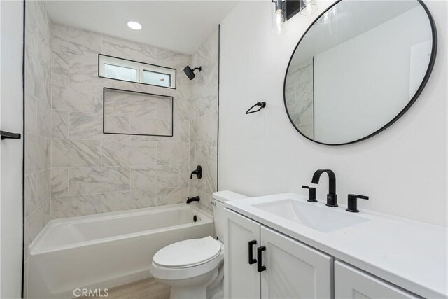 full bathroom with recessed lighting, bathtub / shower combination, toilet, vanity, and wood finished floors