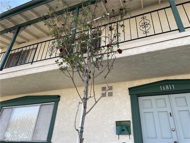exterior space featuring stucco siding