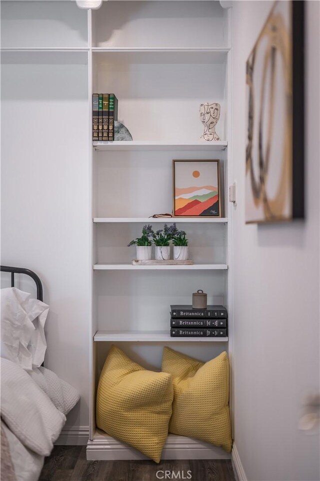 sitting room featuring dark wood-style floors and baseboards