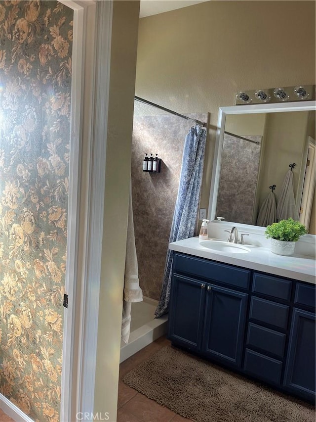 full bath with vanity and tile patterned floors