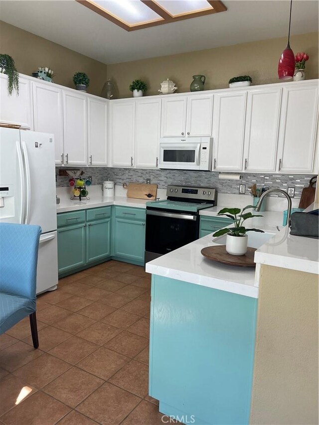 kitchen featuring white cabinets, white appliances, tasteful backsplash, and light countertops