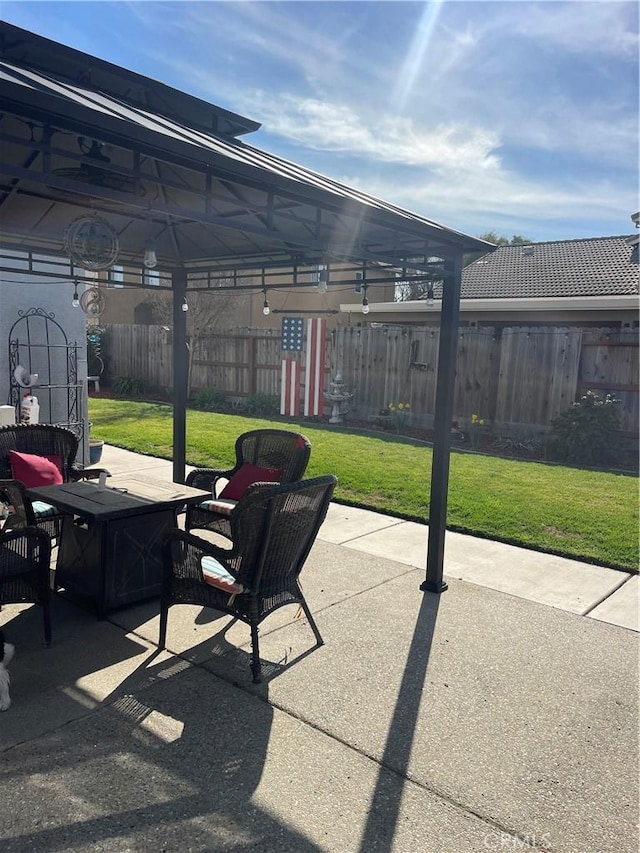 view of patio / terrace featuring fence and a gazebo