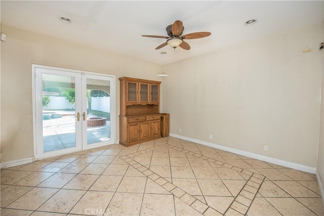 empty room with light tile patterned floors, french doors, recessed lighting, and baseboards