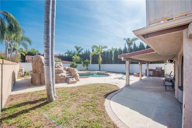 view of yard with a patio, area for grilling, a fenced backyard, and a fenced in pool