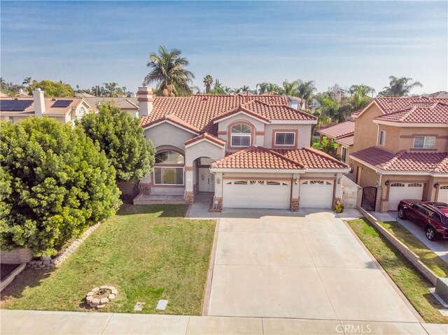 mediterranean / spanish-style house with a garage, driveway, a residential view, stucco siding, and a front yard