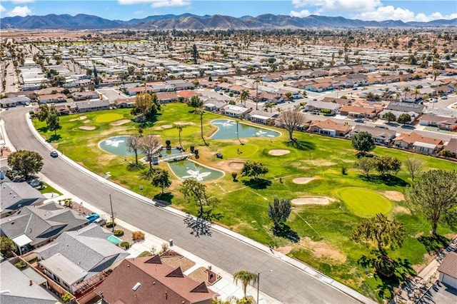 birds eye view of property with a residential view, a mountain view, and golf course view