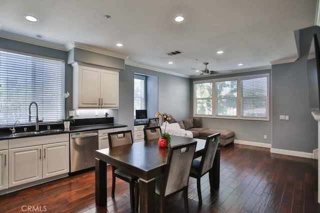 264 Blue Sky Dr, Tustin, CA 92782 - kitchen featuring stainless steel dishwasher, a sink, dark countertops, visible vents, and crown molding