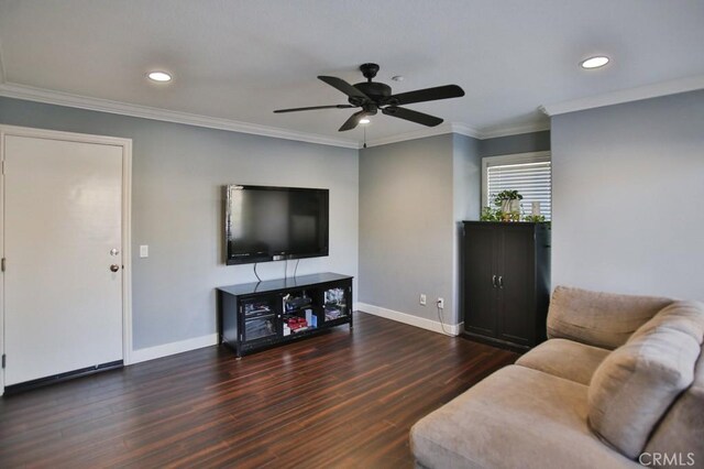 living area with crown molding, dark wood finished floors, and baseboards