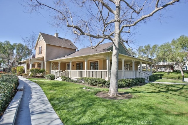 264 Blue Sky Dr, Tustin, CA 92782 - view of side of property featuring covered porch and a yard