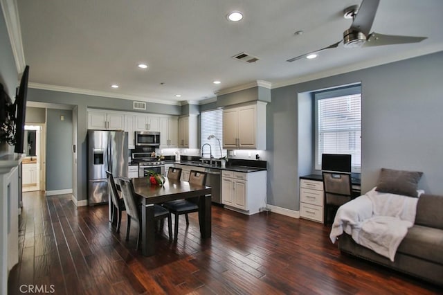 264 Blue Sky Dr, Tustin, CA 92782 - kitchen with visible vents, a sink, crown molding, baseboards, and appliances with stainless steel finishes