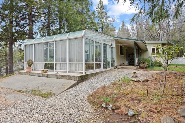 rear view of property with driveway