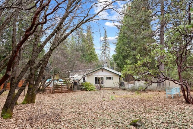 back of house with fence