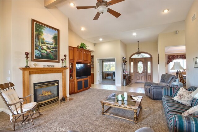 living area with high vaulted ceiling, recessed lighting, light colored carpet, and light tile patterned flooring