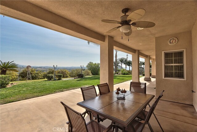 view of patio / terrace featuring a ceiling fan and outdoor dining area