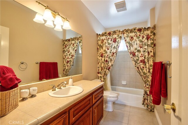 full bathroom with shower / bath combination with curtain, visible vents, toilet, vanity, and tile patterned flooring