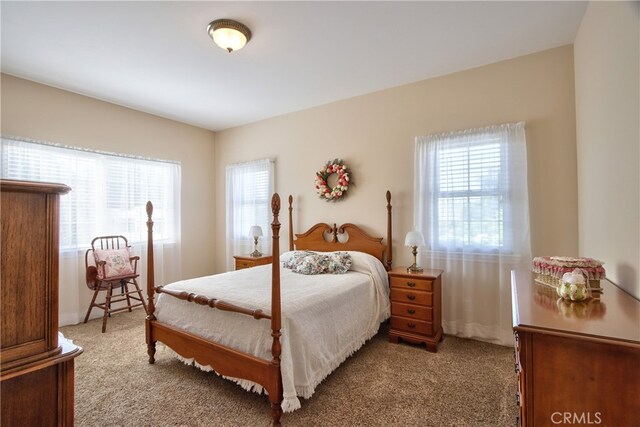 bedroom with light colored carpet