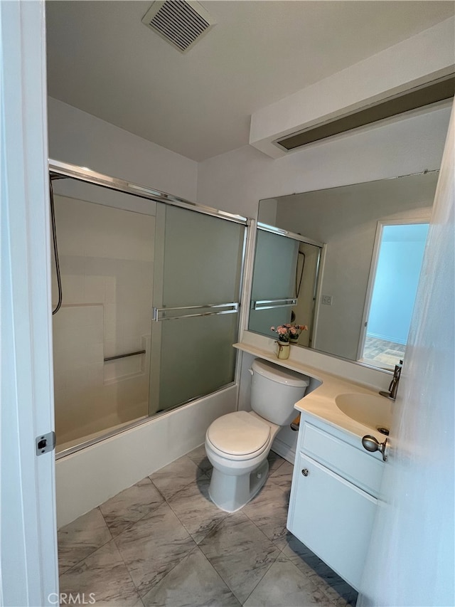 full bath with toilet, vanity, visible vents, marble finish floor, and combined bath / shower with glass door