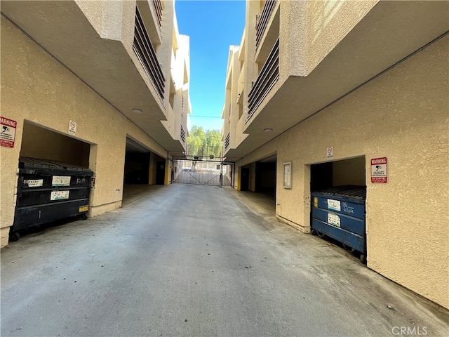10115 Pinewood Ave Unit 102, Tujunga, CA 91042 - view of concrete driveway featuring a gate