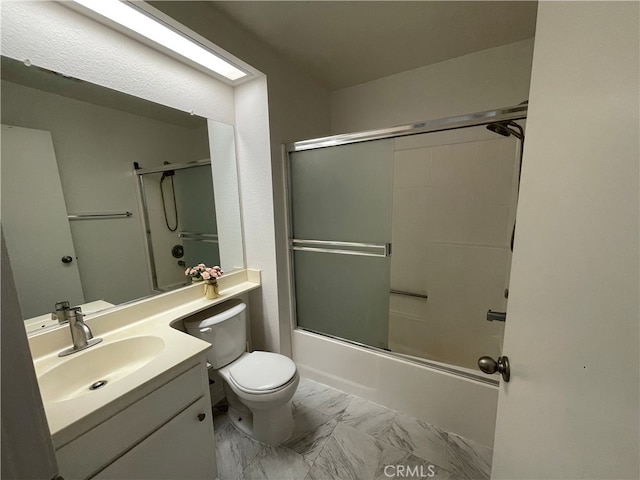 bathroom featuring marble finish floor, combined bath / shower with glass door, vanity, and toilet