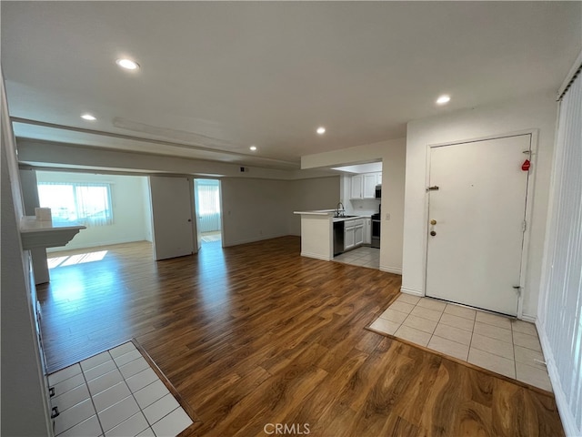 10115 Pinewood Ave Unit 102, Tujunga, CA 91042 - unfurnished living room with light wood-type flooring and recessed lighting