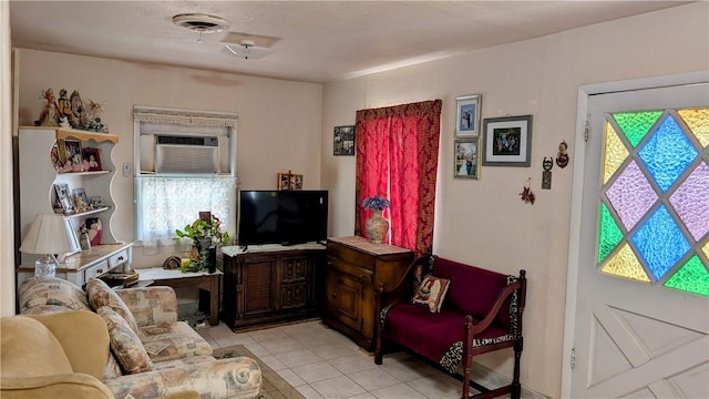 living room with light tile patterned floors and visible vents