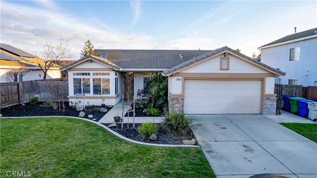 ranch-style house with an attached garage, fence, driveway, a tiled roof, and a front lawn