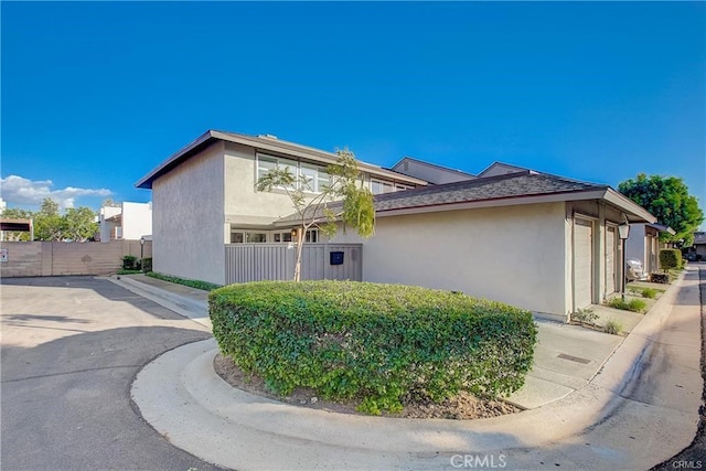 14142 Via Posada Unit 29, Tustin, CA 92780 - view of side of home with stucco siding