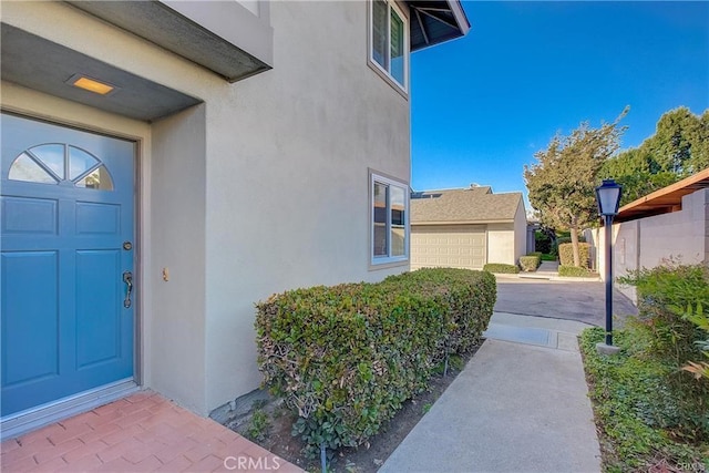 entrance to property with stucco siding