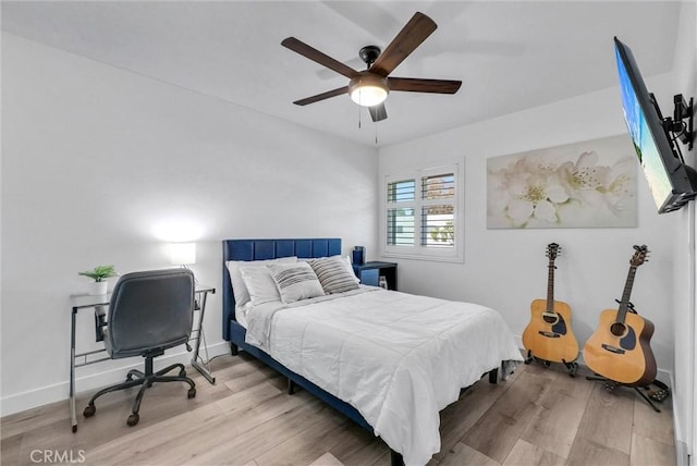14142 Via Posada Unit 29, Tustin, CA 92780 - bedroom with wood finished floors and a ceiling fan