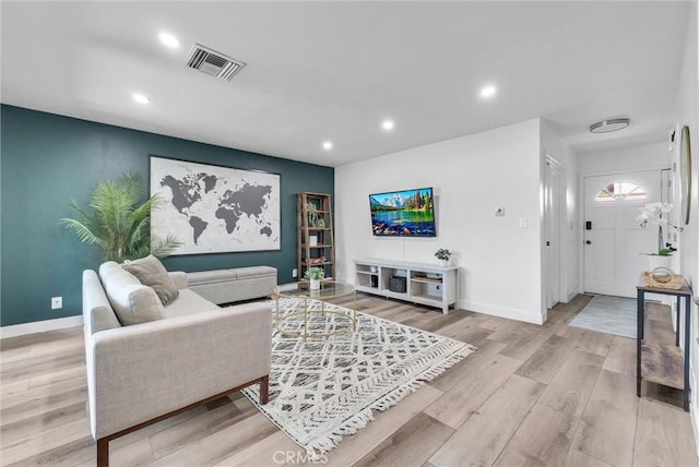 14142 Via Posada Unit 29, Tustin, CA 92780 - living area with recessed lighting and light wood-style flooring