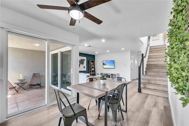 14142 Via Posada Unit 29, Tustin, CA 92780 - dining space featuring light wood-style floors, ceiling fan, stairway, and recessed lighting