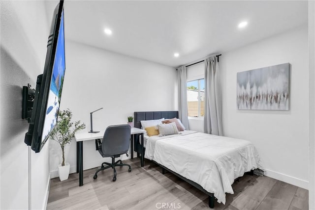 14142 Via Posada Unit 29, Tustin, CA 92780 - bedroom with wood finished floors and recessed lighting