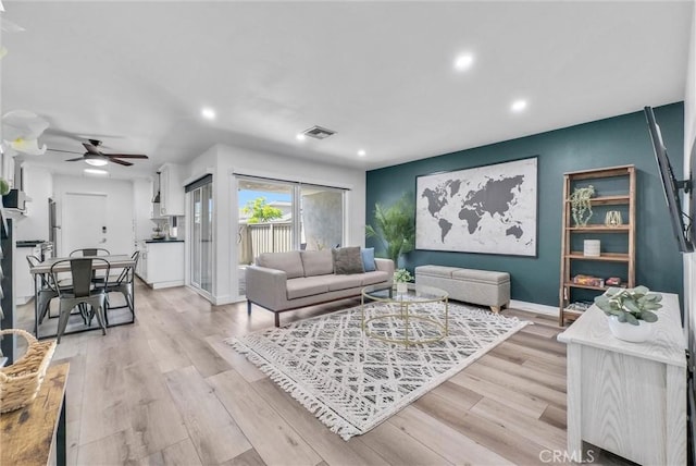 14142 Via Posada Unit 29, Tustin, CA 92780 - living room with recessed lighting, a ceiling fan, and light wood finished floors