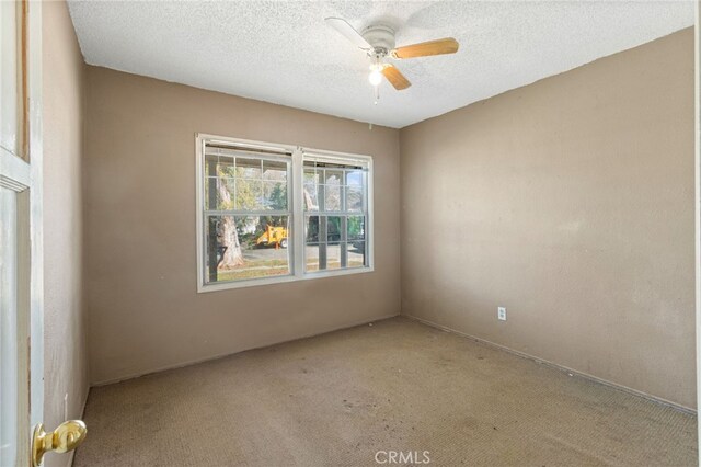 847 W 25th St, San Bernardino, CA 92405 - empty room with carpet floors, a ceiling fan, and a textured ceiling