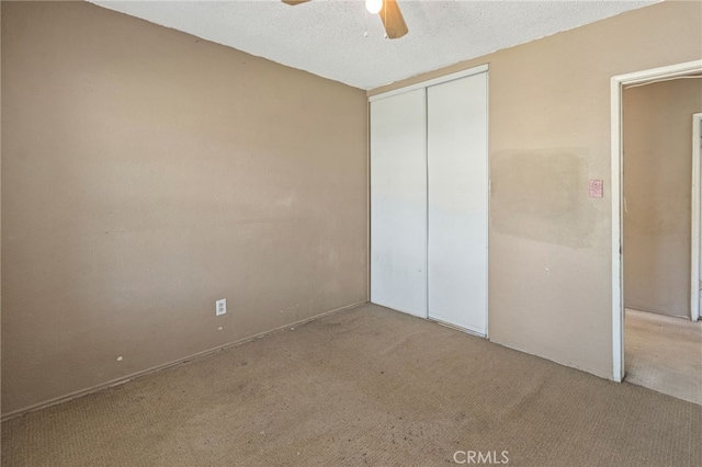 847 W 25th St, San Bernardino, CA 92405 - unfurnished bedroom with a textured ceiling, a closet, a ceiling fan, and carpet flooring