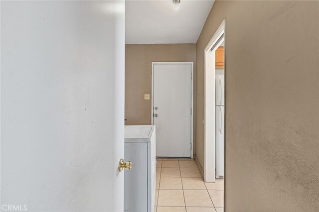 847 W 25th St, San Bernardino, CA 92405 - hallway featuring washer / dryer and light tile patterned floors