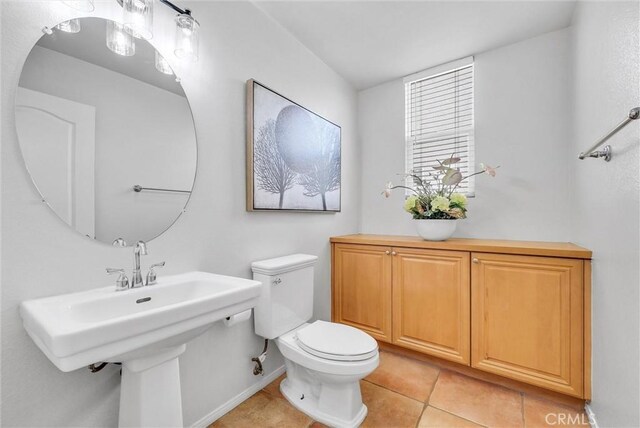 bathroom featuring toilet and tile patterned floors