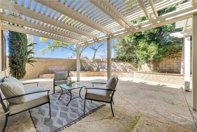 view of patio with a fenced backyard and a pergola