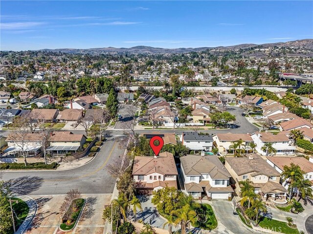 birds eye view of property featuring a residential view and a mountain view