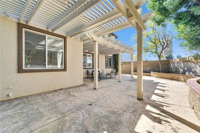 view of patio / terrace with a fenced backyard and a pergola